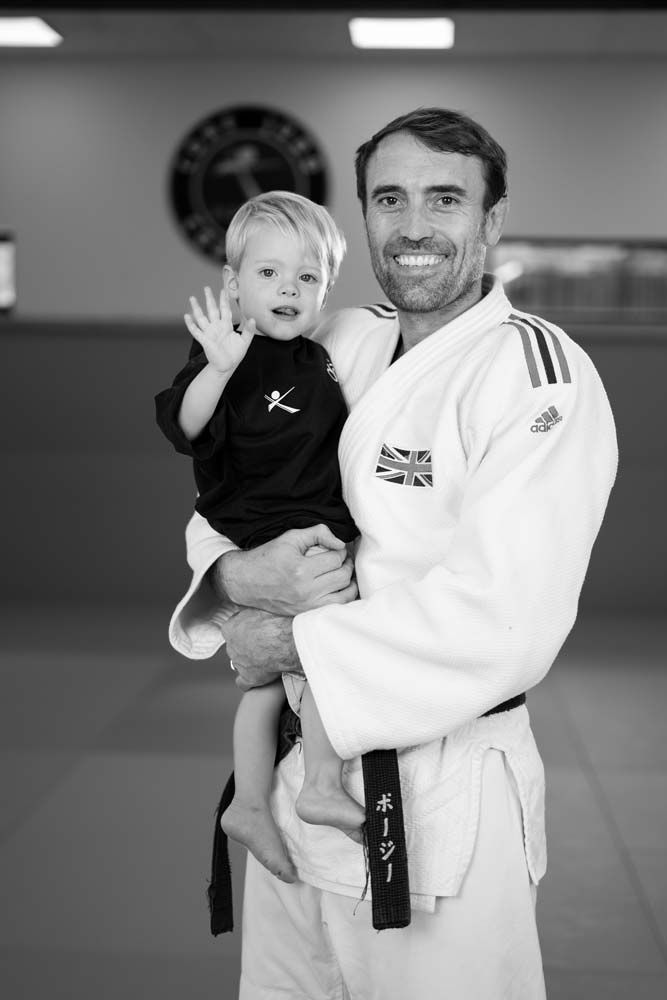 An ex-Olympic coach instructing children's Judo classes in Surrey.